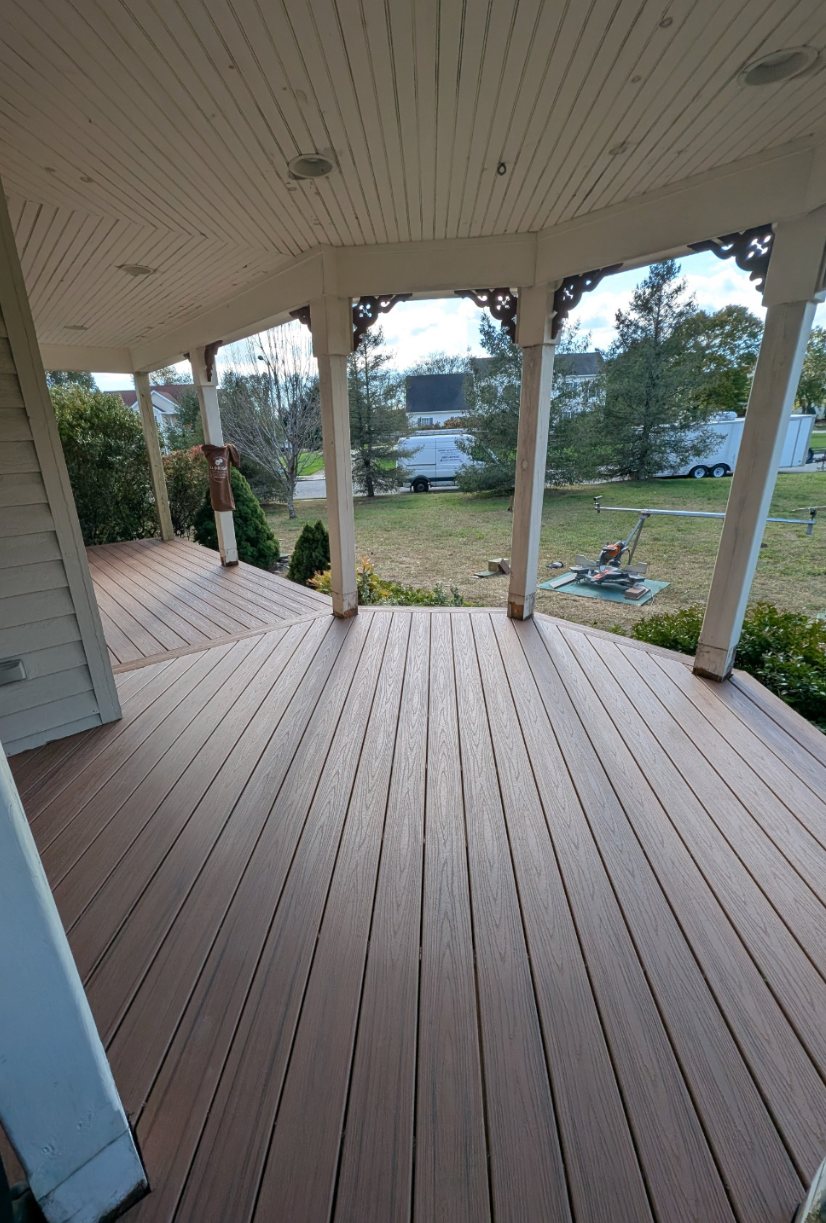 Composite Porch Decking — Low-maintenance composite decking on a wraparound covered porch.