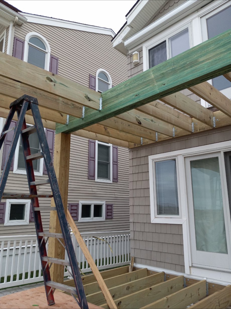 Deck Framing & Pergola — New deck framing and pergola posts going up — properly sized and set.